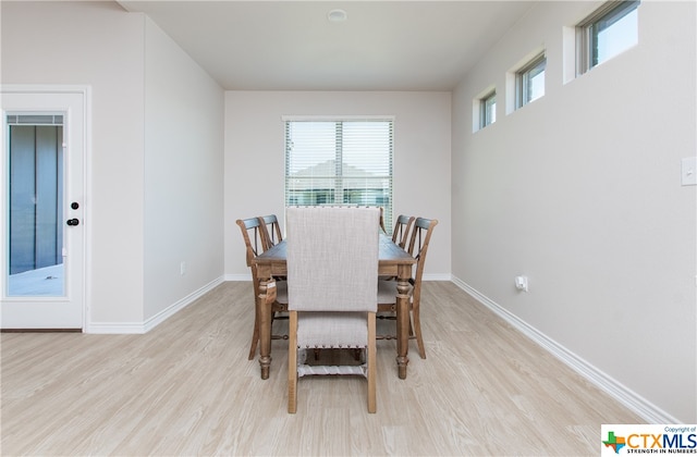 dining area with light wood-type flooring