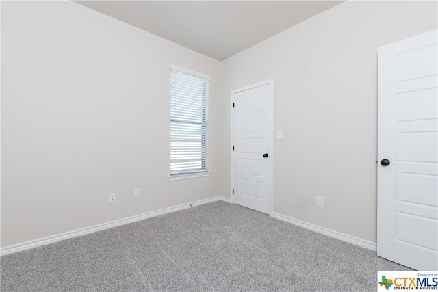 empty room featuring carpet floors