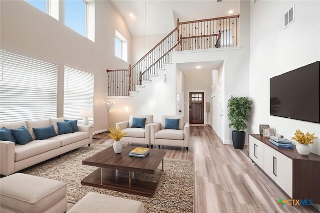 living room with light hardwood / wood-style floors