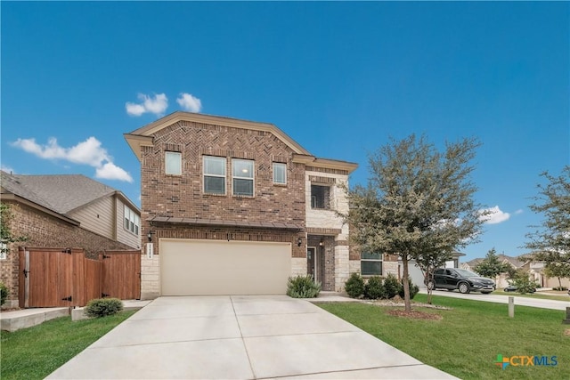 view of front of property with a garage and a front lawn