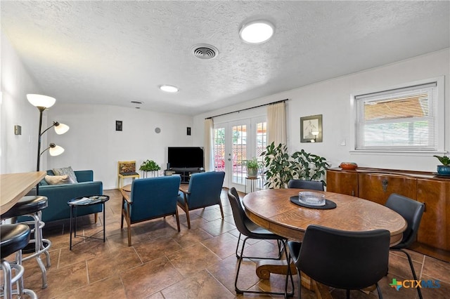 3301 Antelope Trl, Temple, TX 76504 - dining area with french doors and a textured ceiling