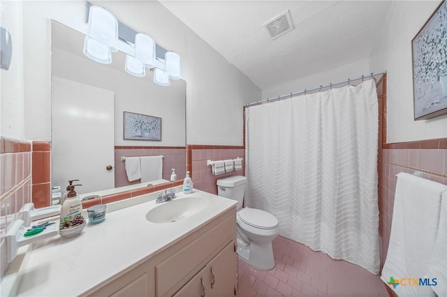 3301 Antelope Trl, Temple, TX 76504 - bathroom with tile walls, vanity, tile patterned floors, wainscoting, and a shower with curtain