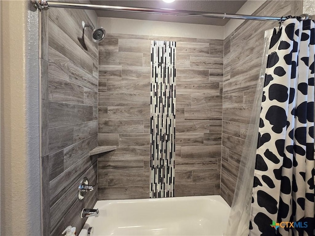 bathroom featuring shower / bath combination with curtain