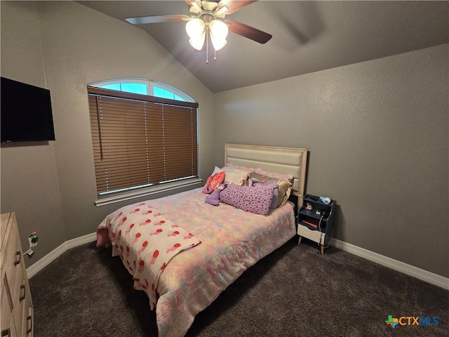 bedroom featuring vaulted ceiling, ceiling fan, and dark carpet