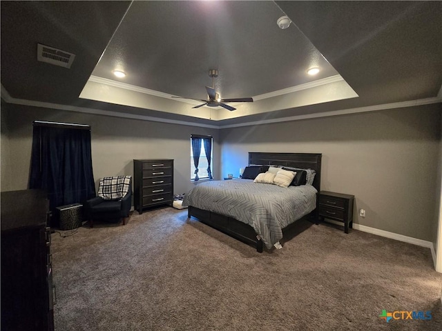 carpeted bedroom with ceiling fan, crown molding, and a raised ceiling