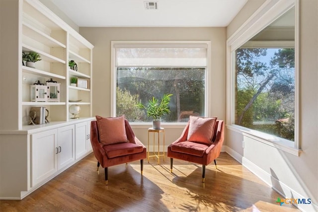 living area with light hardwood / wood-style floors