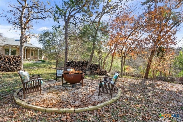 view of patio featuring ceiling fan, area for grilling, and a pergola