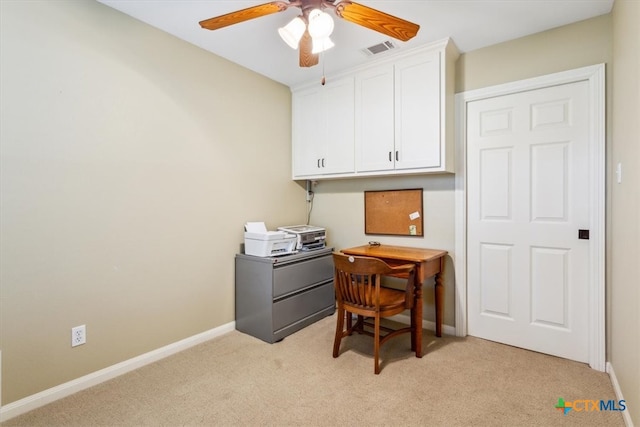 carpeted office with ceiling fan