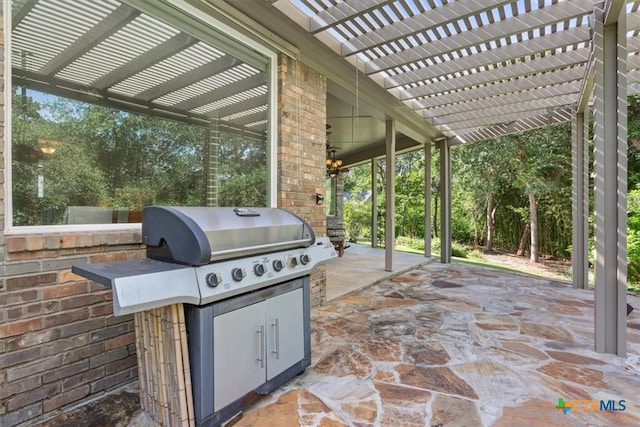 view of patio with a pergola and a grill