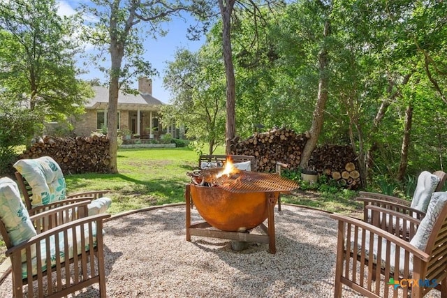 view of patio / terrace featuring an outdoor fire pit