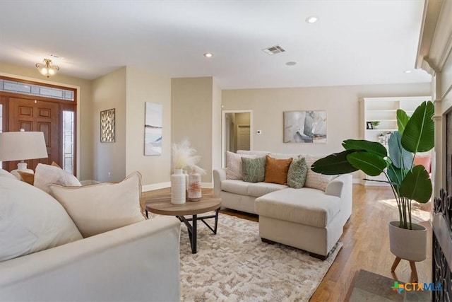 living room with light hardwood / wood-style floors