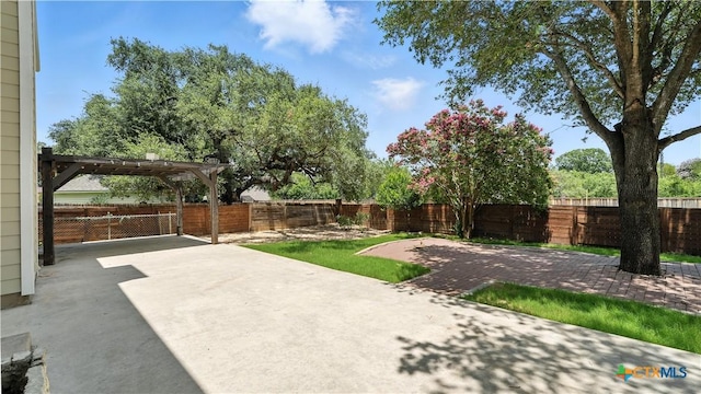 fenced backyard with a patio and a pergola