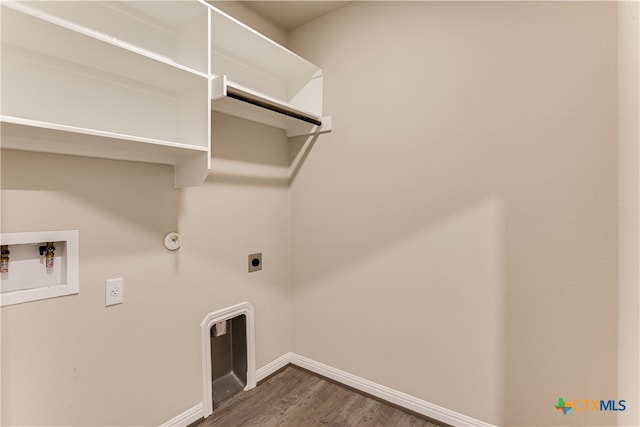 laundry room with hookup for a gas dryer, electric dryer hookup, washer hookup, and dark hardwood / wood-style flooring