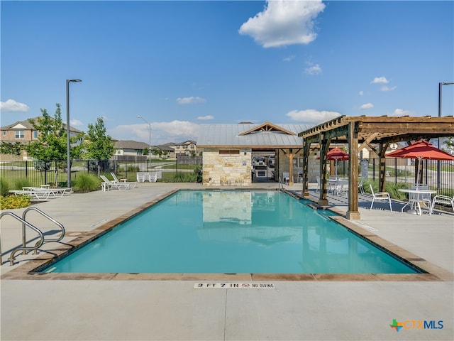 view of pool featuring a pergola and a patio