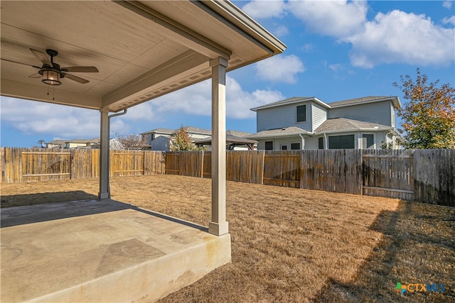 view of yard featuring a patio and ceiling fan