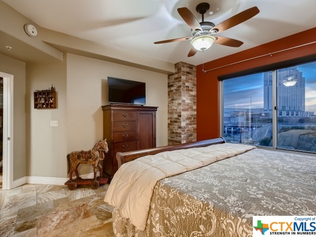 bedroom featuring access to outside and ceiling fan