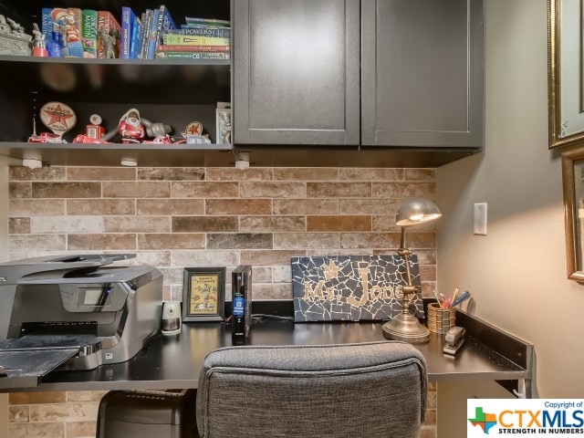 kitchen featuring decorative backsplash and gray cabinetry