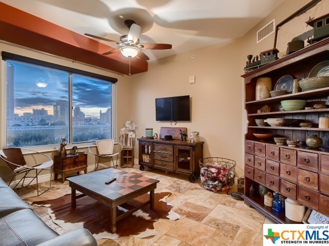 living room with ceiling fan