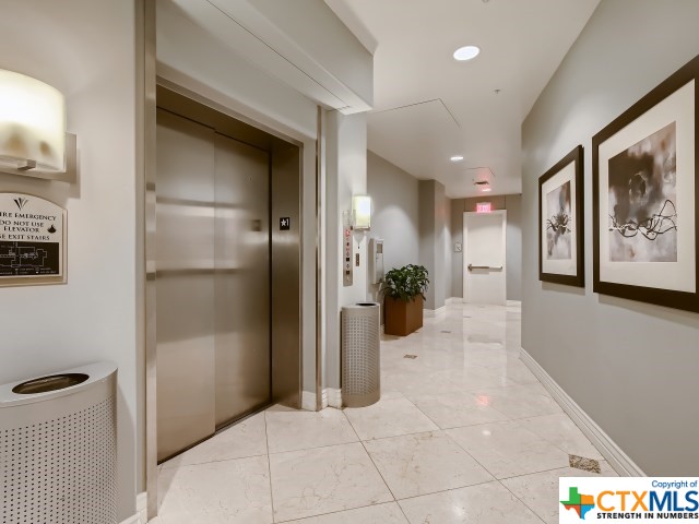 hallway featuring elevator