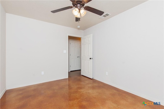 empty room with ceiling fan, finished concrete flooring, and visible vents