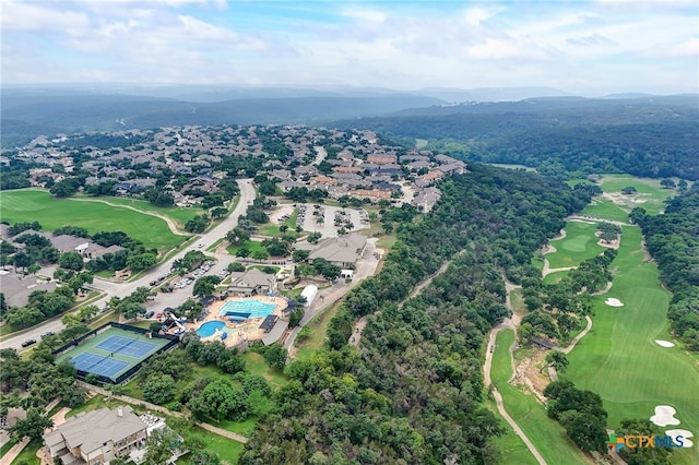 aerial view of residential area featuring a local golf course