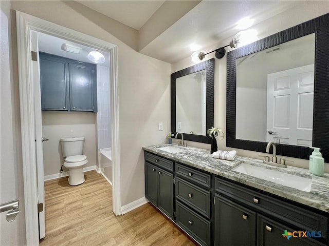 101 Biltmore Dr, Victoria, TX 77904 - full bath with double vanity, wood finished floors, and a bath