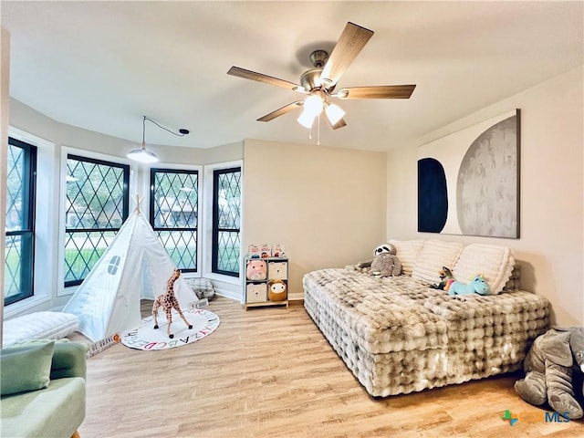 101 Biltmore Dr, Victoria, TX 77904 - bedroom with light wood finished floors and a ceiling fan