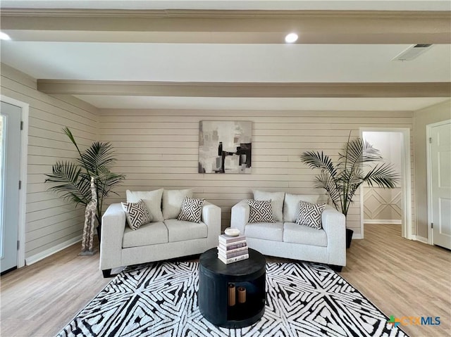 101 Biltmore Dr, Victoria, TX 77904 - living area with light wood finished floors and wood walls