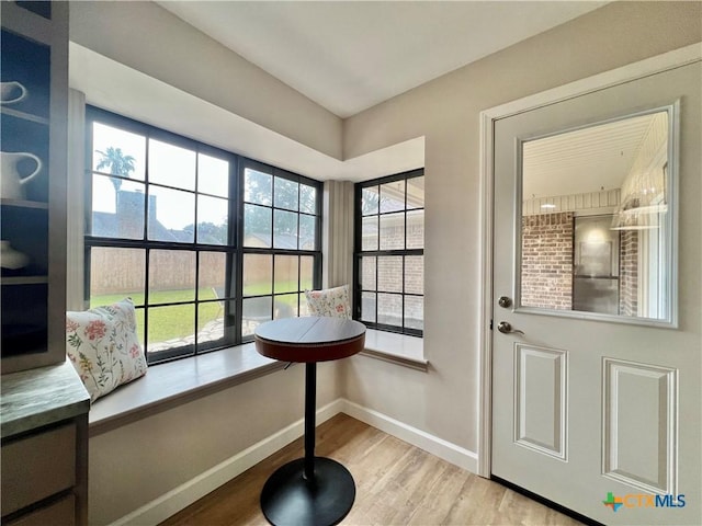 101 Biltmore Dr, Victoria, TX 77904 - doorway with wood finished floors and healthy amount of natural light