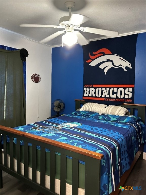 bedroom featuring ceiling fan and dark wood-type flooring