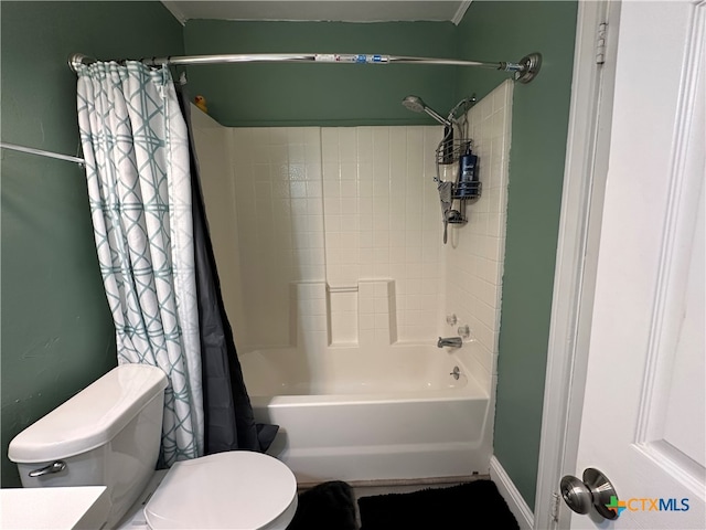 bathroom with toilet and shower / bath combo