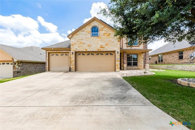 2508 Mugho Dr, Harker Heights, TX 76548 - view of front facade featuring a front yard, stone siding, a garage, and concrete driveway