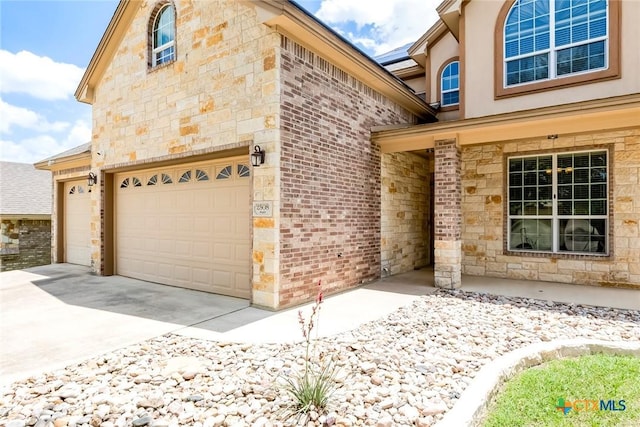 2508 Mugho Dr, Harker Heights, TX 76548 - view of home's exterior featuring brick siding, stone siding, and concrete driveway