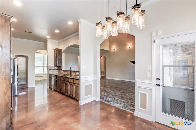 2508 Mugho Dr, Harker Heights, TX 76548 - kitchen featuring arched walkways, finished concrete floors, stone counters, crown molding, and pendant lighting