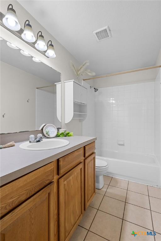 1413 Hopi Trl, Harker Heights, TX 76548 - bathroom featuring tile patterned floors, vanity, and tub / shower combination