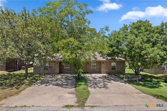 1413 Hopi Trl, Harker Heights, TX 76548 - view of front of home featuring driveway, a front lawn, and brick siding