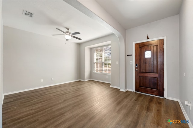 foyer with ceiling fan and dark wood-type flooring