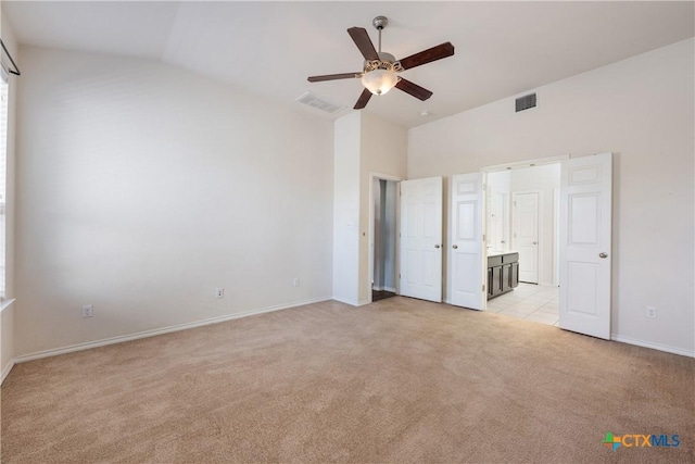 3709 Rusack Dr, Killeen, TX 76542 - unfurnished bedroom with light colored carpet, baseboards, high vaulted ceiling, ceiling fan, and ensuite bathroom