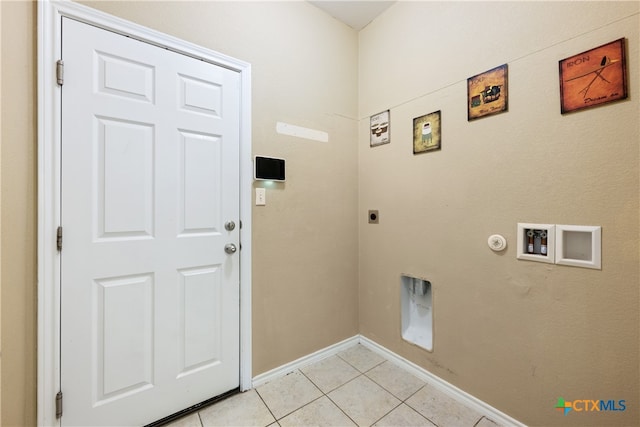 laundry area with electric dryer hookup, hookup for a gas dryer, hookup for a washing machine, and light tile patterned flooring