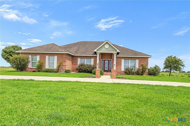 444 E Maxwell Ditch Rd, Port Lavaca, TX 77979 - single story home with brick siding and a front yard