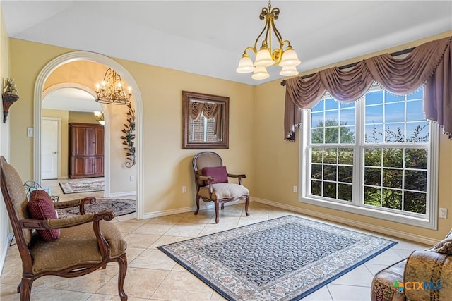 444 E Maxwell Ditch Rd, Port Lavaca, TX 77979 - living area featuring a chandelier, light tile patterned floors, and arched walkways