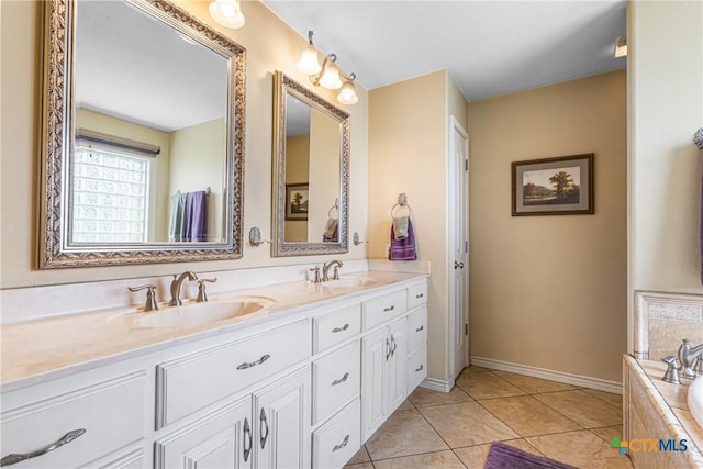 444 E Maxwell Ditch Rd, Port Lavaca, TX 77979 - full bath with double vanity, tiled tub, and tile patterned floors