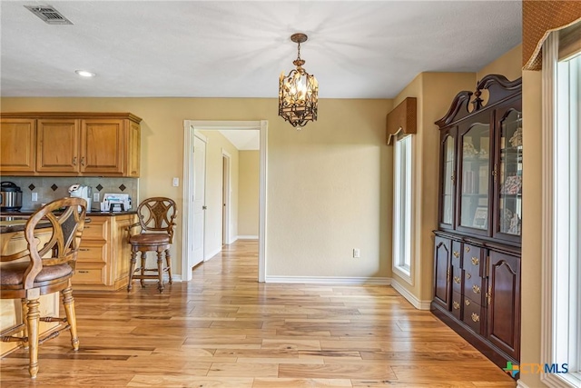 444 E Maxwell Ditch Rd, Port Lavaca, TX 77979 - dining room featuring light wood-style flooring, a chandelier, and recessed lighting