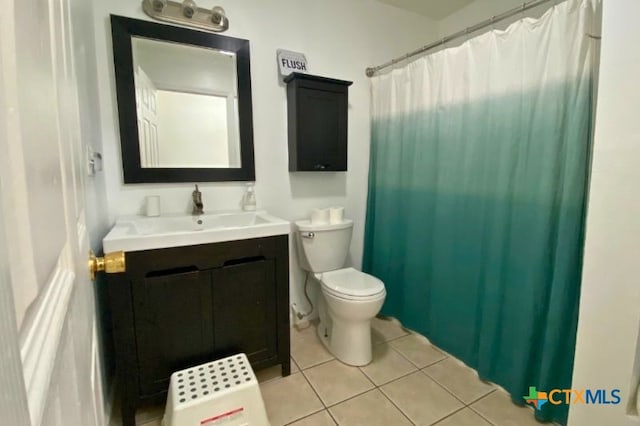 953 County Road 3351, Kempner, TX 76539 - bathroom with tile patterned flooring, curtained shower, toilet, and vanity