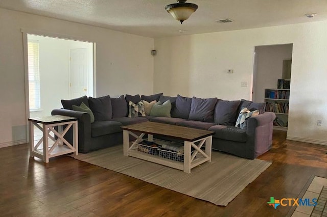 953 County Road 3351, Kempner, TX 76539 - living area featuring visible vents, baseboards, and wood finished floors