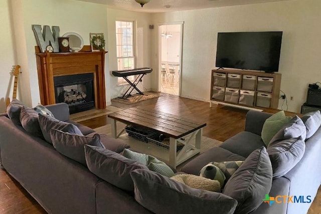 953 County Road 3351, Kempner, TX 76539 - living room with a fireplace with flush hearth and wood finished floors