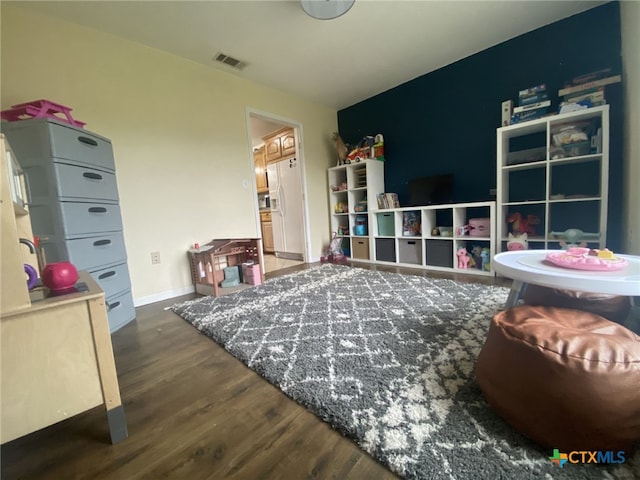 953 County Road 3351, Kempner, TX 76539 - rec room featuring baseboards, wood finished floors, and visible vents