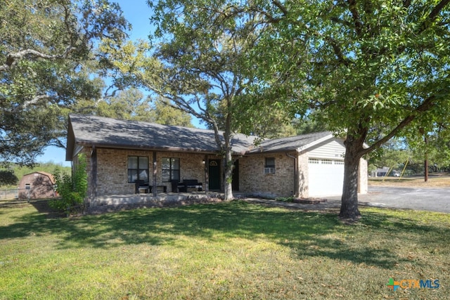 view of front facade with a garage and a front yard