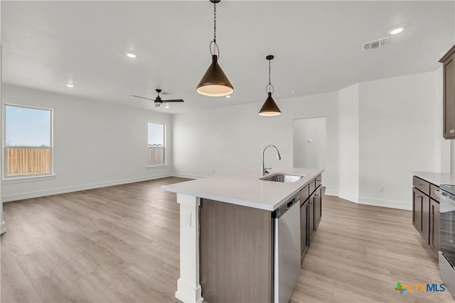 2318 Healy Dr, Temple, TX 76502 - kitchen featuring a sink, stainless steel appliances, ceiling fan, light countertops, and decorative light fixtures