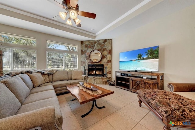 10510 Teich Loop, New Braunfels, TX 78132 - living room featuring crown molding, light tile patterned floors, vaulted ceiling, and a stone fireplace